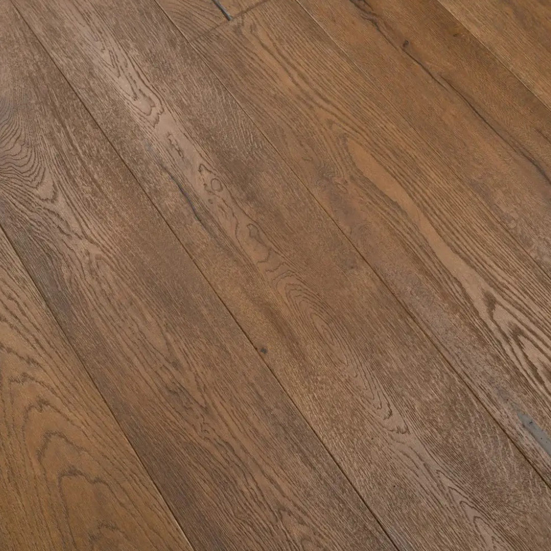 Medium brown hardwood flooring planks with visible natural grain patterns and subtle tonal variation.