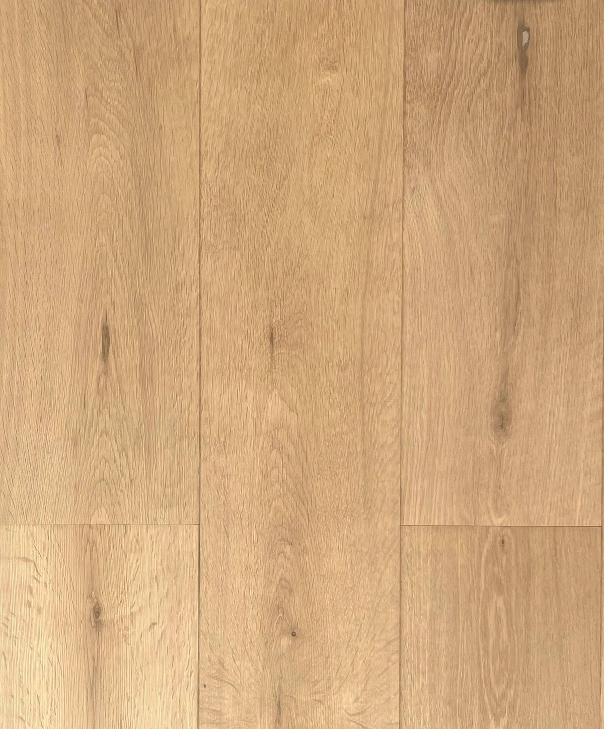 Light oak wood flooring planks with visible natural grain patterns and warm tan tones.