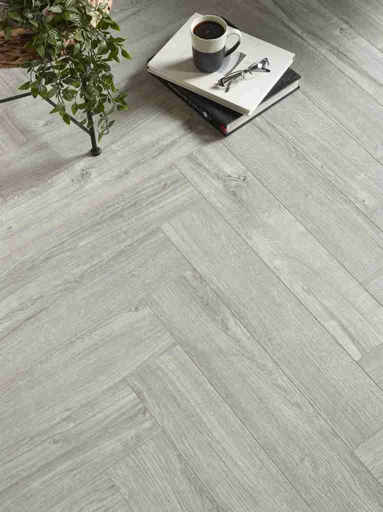 Light grey herringbone SPC flooring with click system