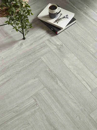 Light grey herringbone SPC flooring with click system
