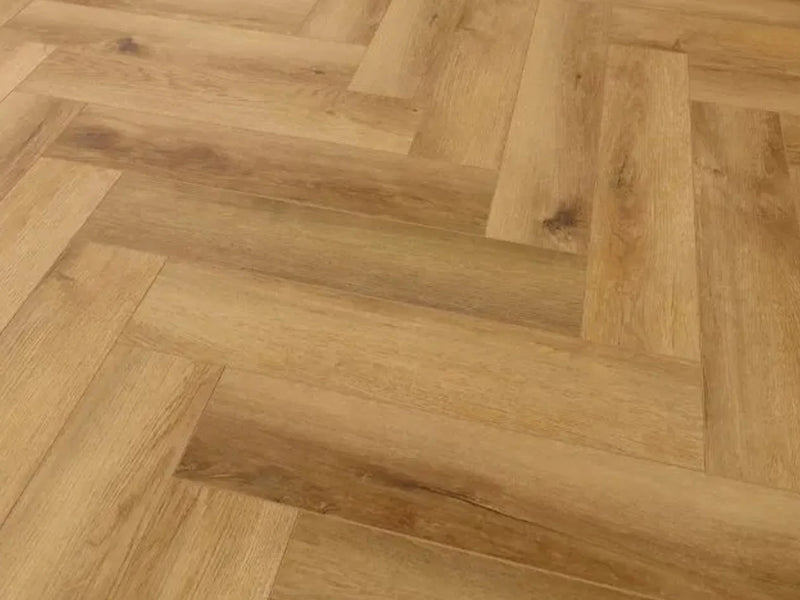 Natural oak herringbone wood flooring in a modern interior