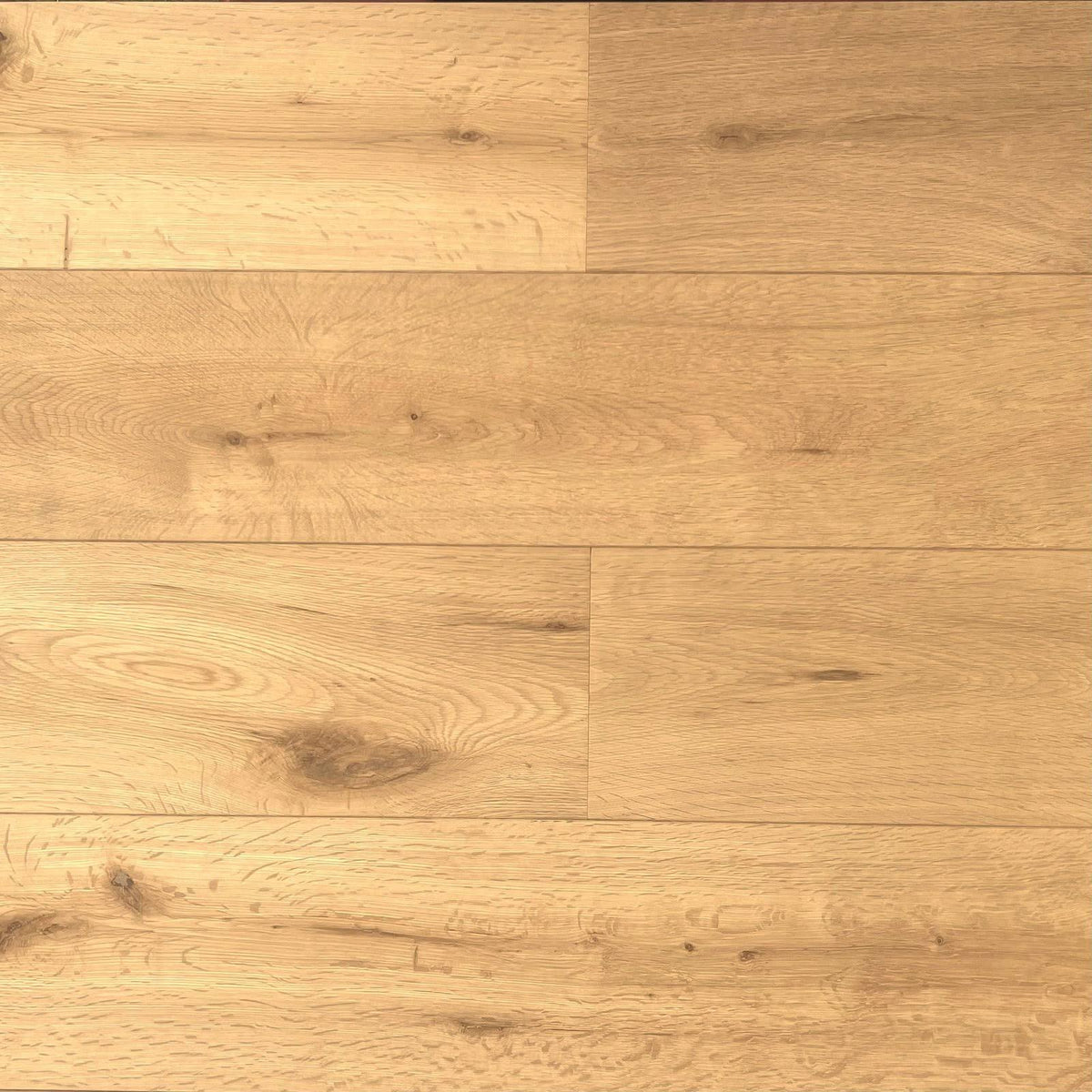 Light oak wood flooring planks with visible grain, knots, and natural texture in warm beige and tan tones.