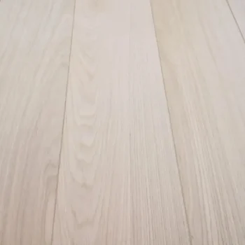 Angled close-up of Prime AB Grade Unfinished Oak flooring featuring clean grain and broad surface finish