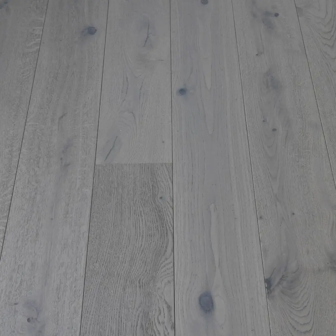 Angled front-facing view of Light Grey Rustic Oak flooring with brushed texture and matt lacquer