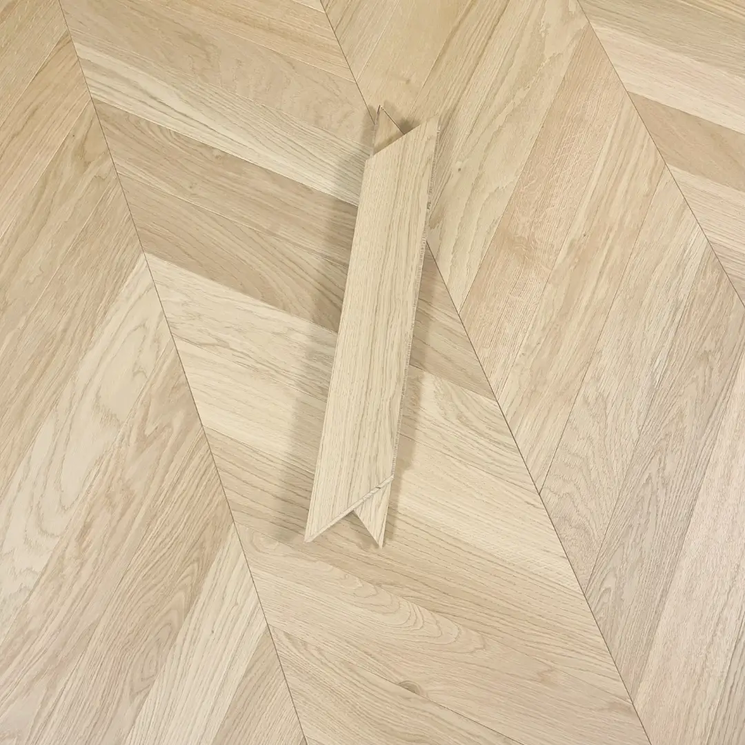 Luxury Chevron Invisible Oak Oiled Flooring showcasing brushed European oak with seamless V-shaped pattern and invisible oiled finish.
