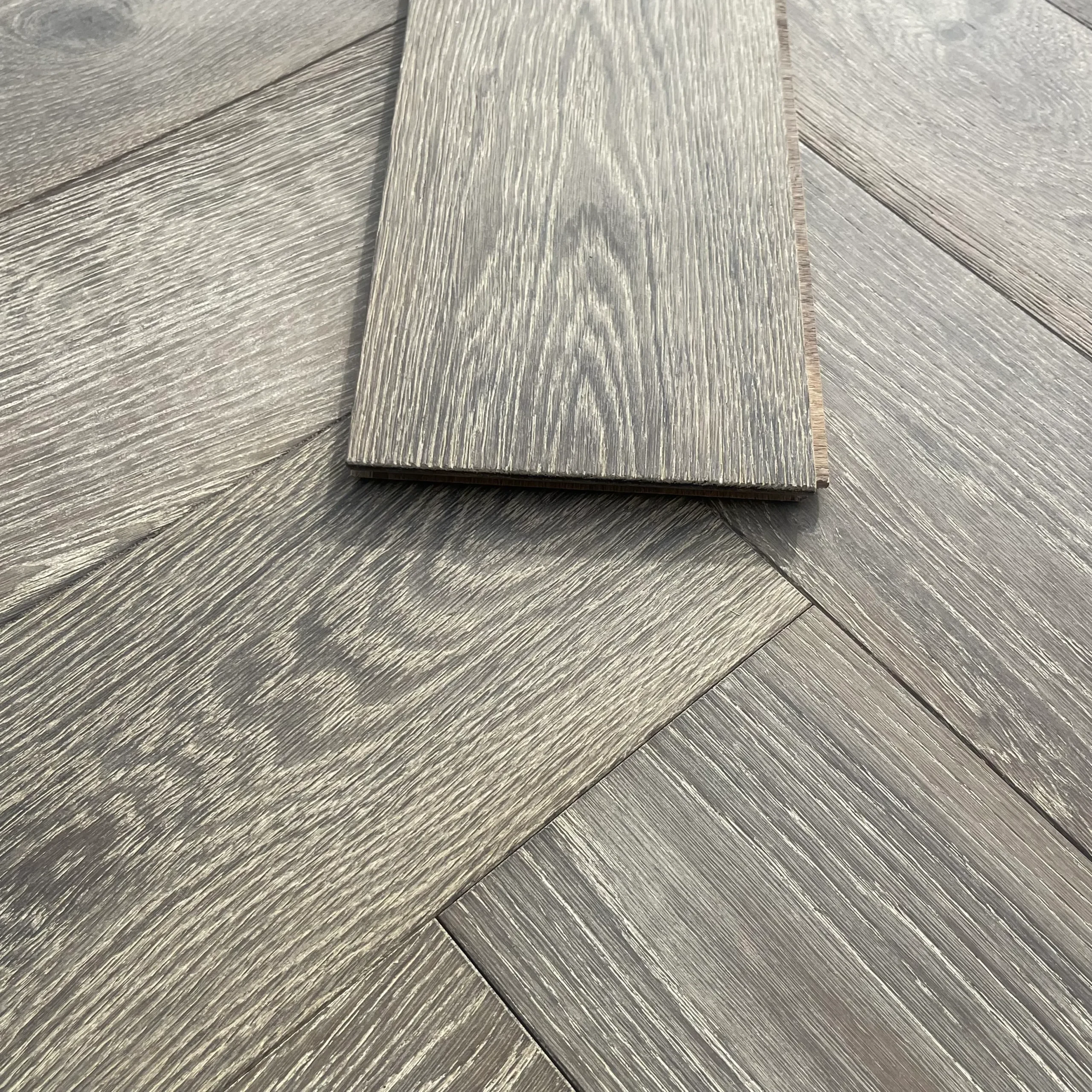 Parquet Manhattan Grey Oak Brushed and Oiled Flooring close up with individual parquet piece
