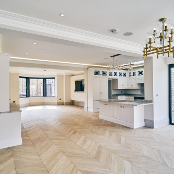 Invisible Oak chevron engineered wood flooring fitted in an open plan interior
