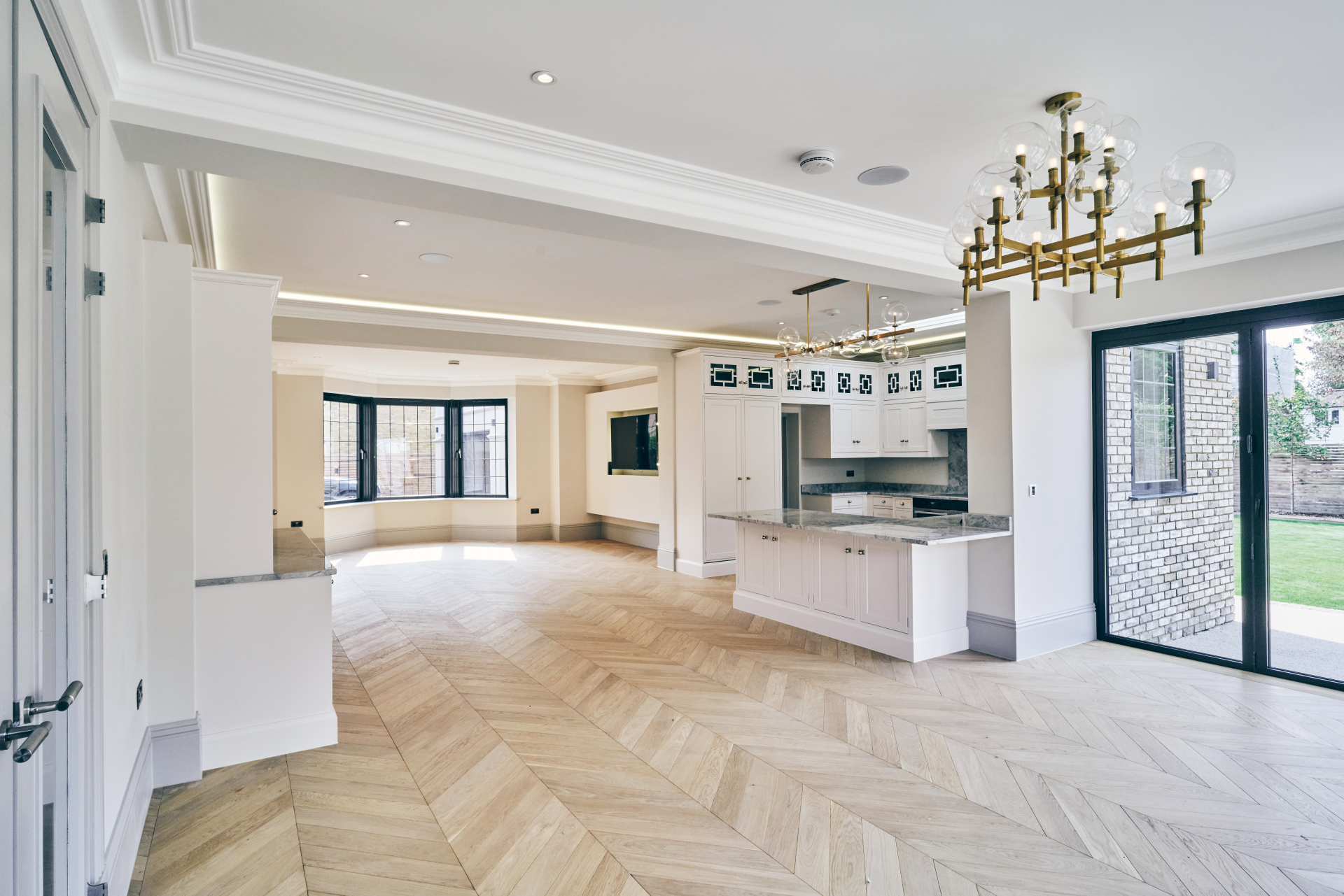 Invisible Oak chevron engineered wood flooring fitted in an open plan interior