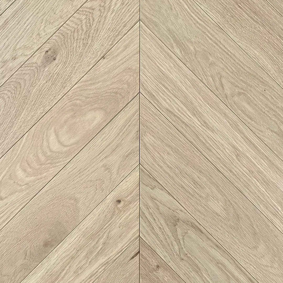 Close-up of invisible finish chevron oak flooring highlighting brushed grain detail and natural texture