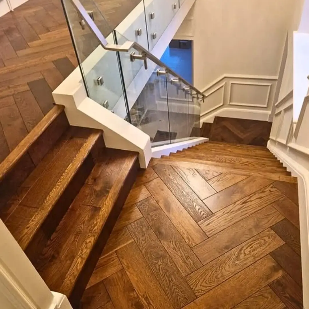 Wide angle view of finished solid oak stair bull nosing on stairs