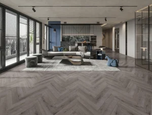 New Deluxe Laminate Carbon Grey Oak Herringbone installed in a modern room – 12 x 101 x 606mm