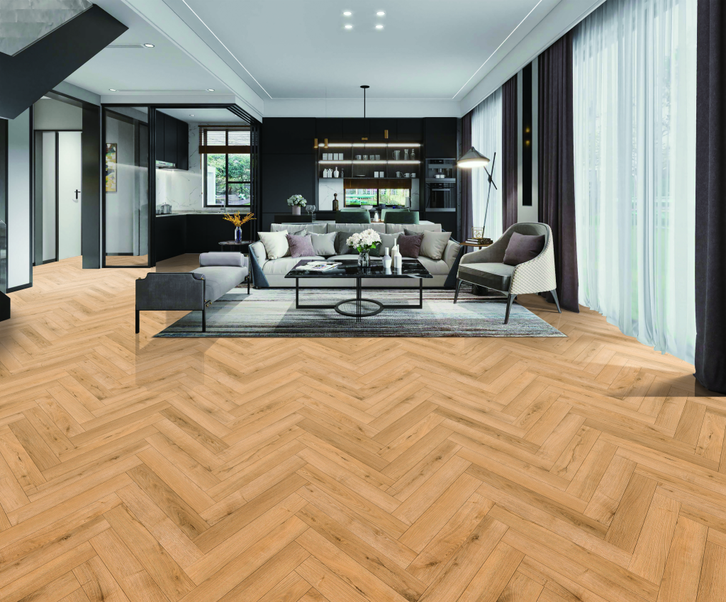 Installed Natural Oak herringbone laminate flooring showing the 12mm Deluxe Herringbone pattern in a warm natural oak colour.
