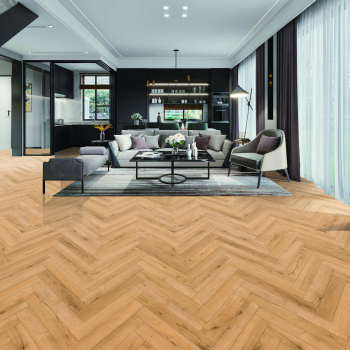 Installed Natural Oak herringbone laminate flooring showing the 12mm Deluxe Herringbone pattern in a warm natural oak colour.