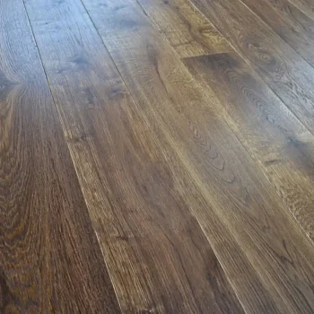 Angled close-up of Eco Range Caramel Smoked Oak Oiled engineered wood flooring showing rich grain and warm tones