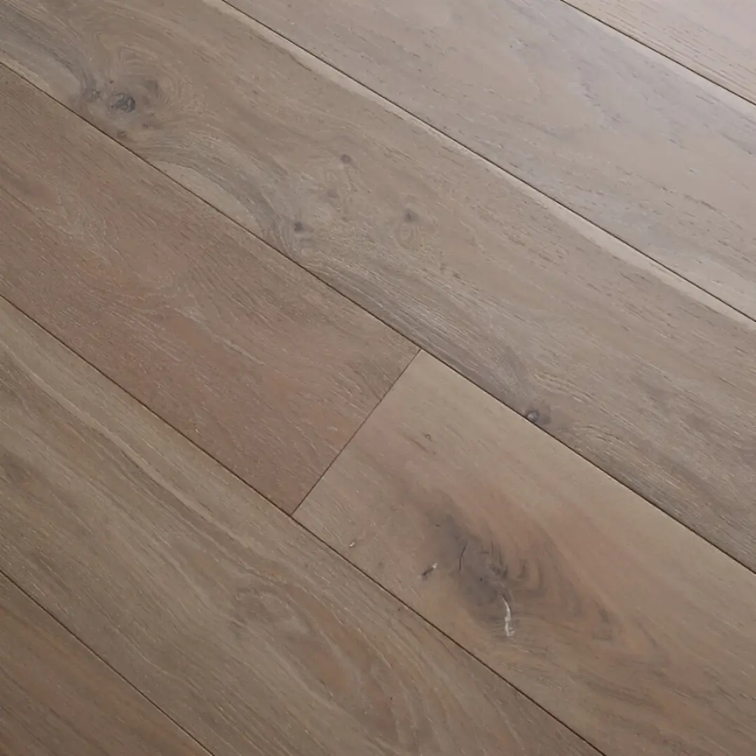 Angled image showing Eco Range Iceberg Oak flooring with light brushed texture and oil-enhanced pale oak surface tones