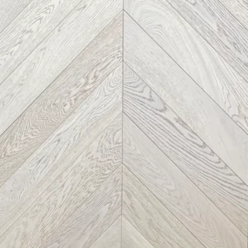 Close up of luxury prime grade invisible chevron brushed oiled oak flooring surface grain and finish