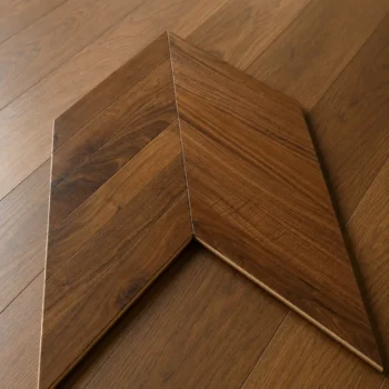 Close up of American Black Walnut chevron flooring showing grain detail and precision cut joints